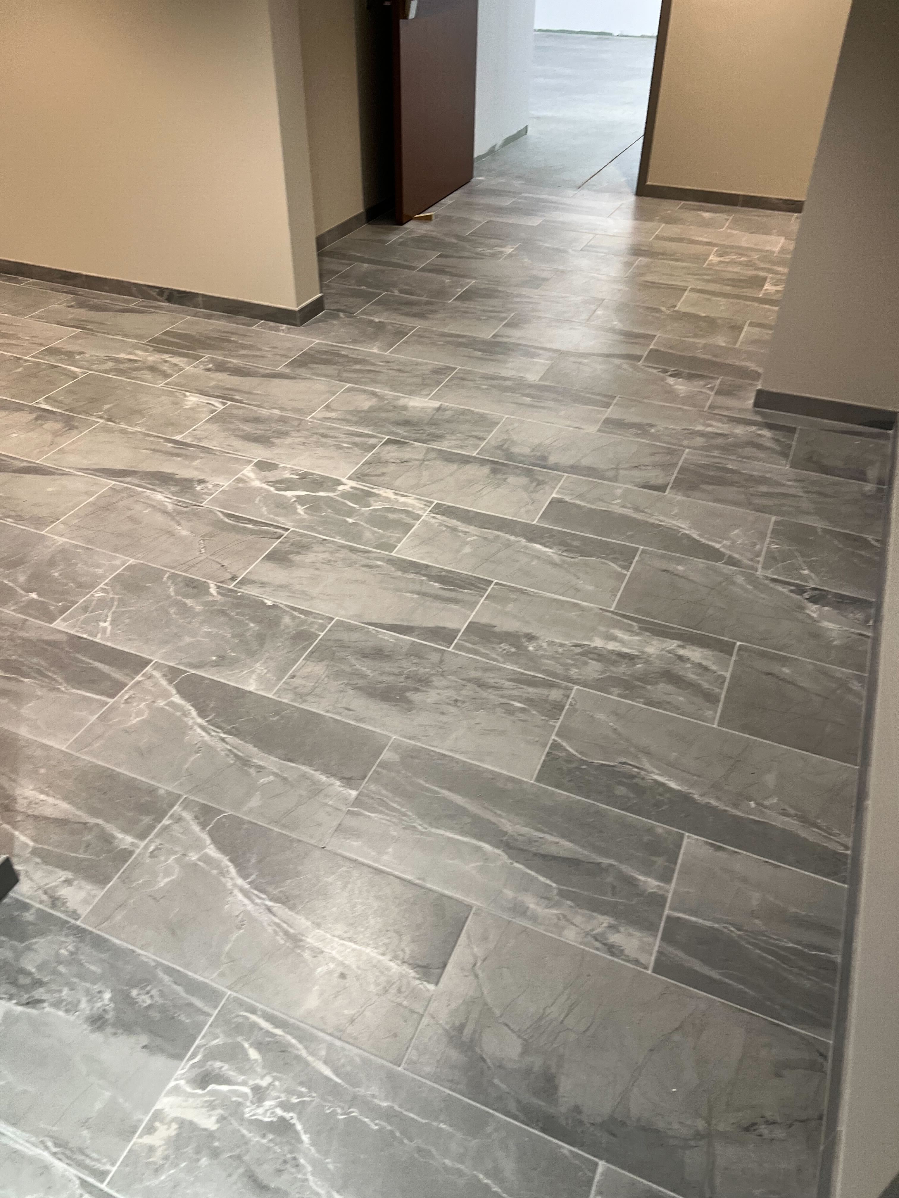 Subway, wood paneling, herringbone porcelain